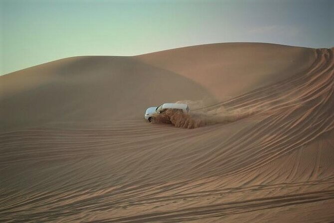 Qatar Sunset Desert Safari: Dune Bashing & Golden Sands Adventure - The camel camp: brief, traditional, and extra