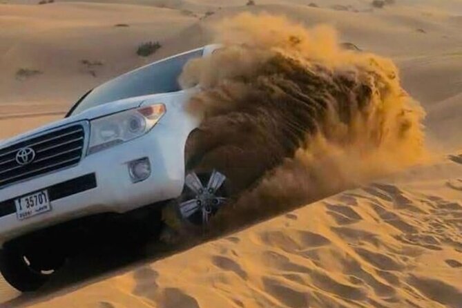 Quad Bike Dubai Desert Safari with BBQ Dinner Sandboard and Show - Lahbab’s red dunes are the action center