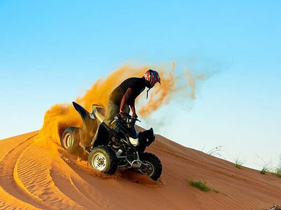 Ras Al Khaimah: Guided Quad Bike Tour - Riding into Ras Al Khaimah’s red dunes