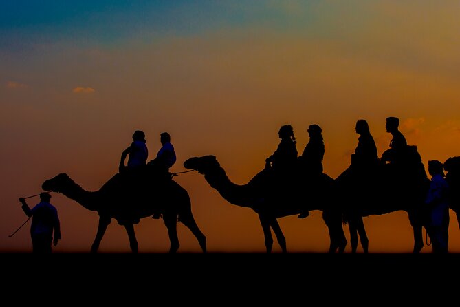 Sunset Camel Trekking with Falcon Show & VIP BBQ Dinner - Leaving Dubai for the camel caravan