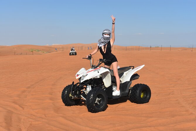 Sunset Desert Safari Quad bike Camel ride Sand Board & BBQ Dinner - Sandboarding with a short learning curve