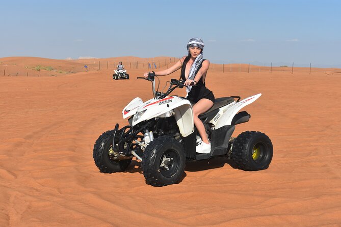 Sunset Desert Safari Quad bike Camel ride Sand Board & BBQ Dinner - Al Lahbab quad biking and dune bashing