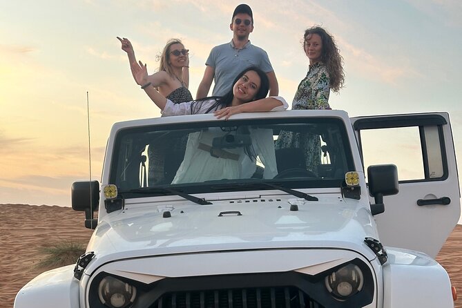 Sunset in Wahiba Sands 4x4 Adventure - Omani dinner at a desert camp