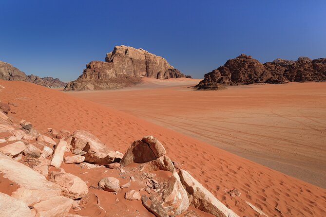 Wadi Rum: Explorer Jeep Tour PASS + Local Food + Optional Stay - Lawrence’s Spring and the first red dunes